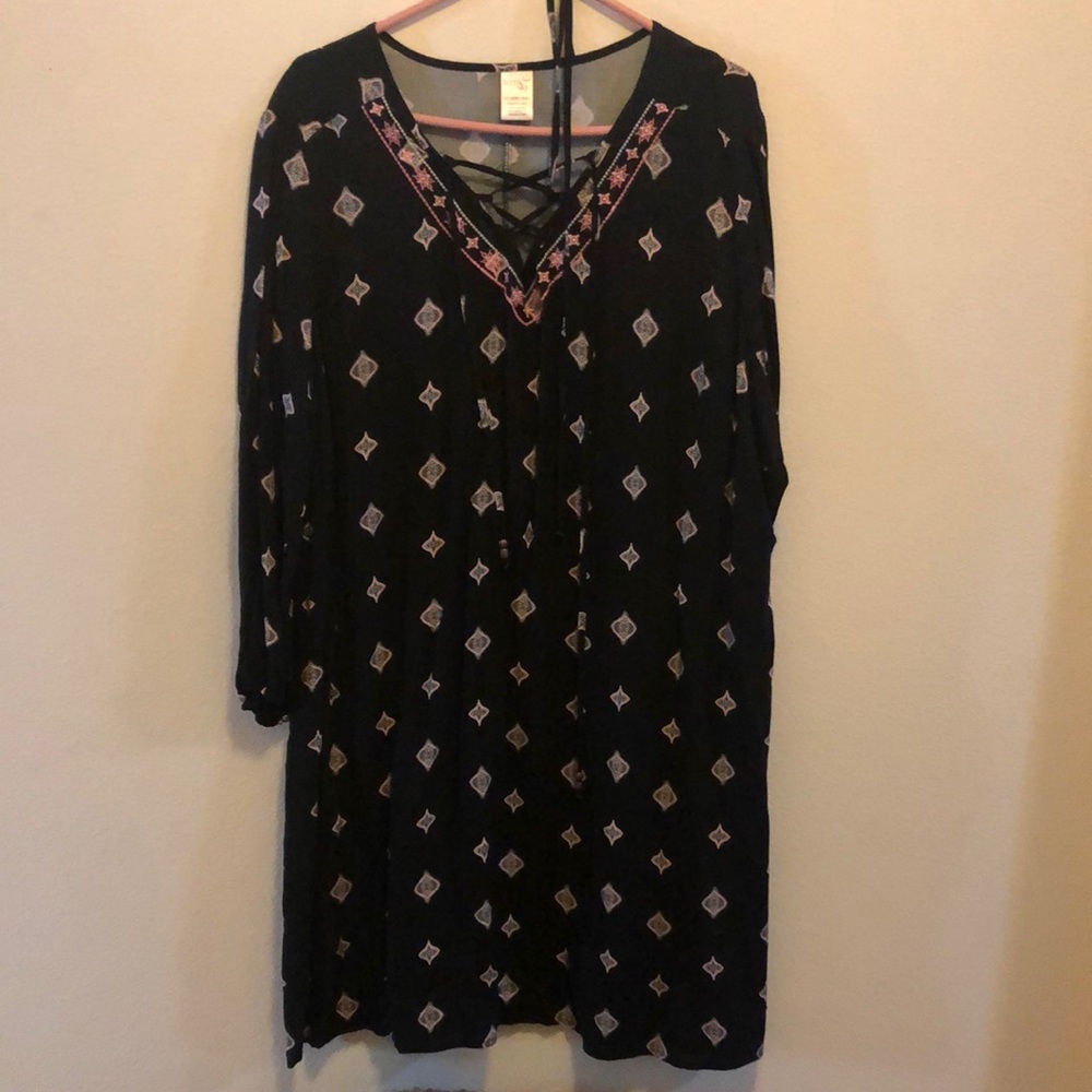 Black with pink and white patterned dress with matching belt.